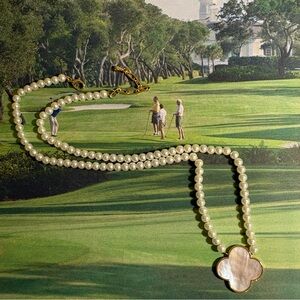 Elegant Pearl Necklace with Clover Pendant